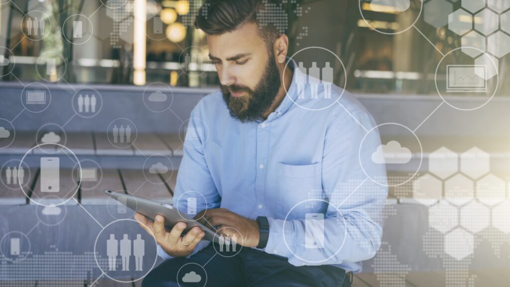 Man on a computer working on social media