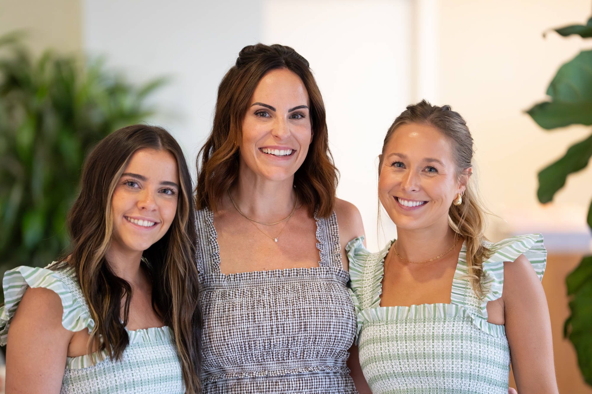 three neon canvas team members at event